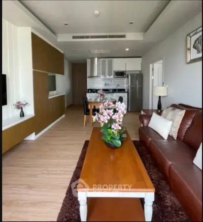 Spacious modern living room with elegant decor and open kitchen layout