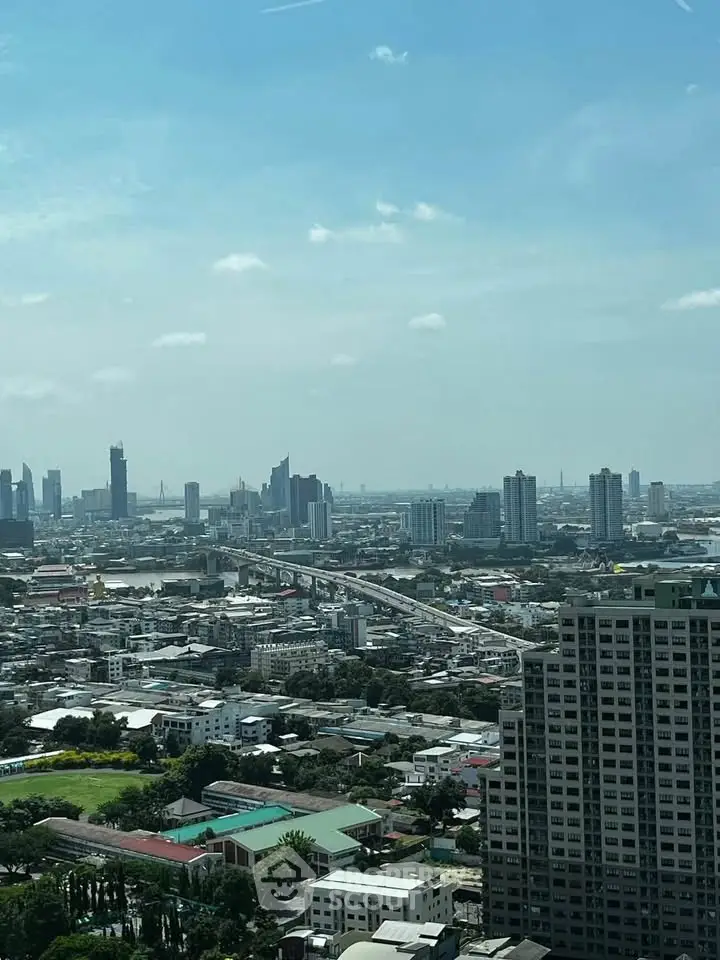 Stunning cityscape view from a high-rise building showcasing urban skyline and architecture.