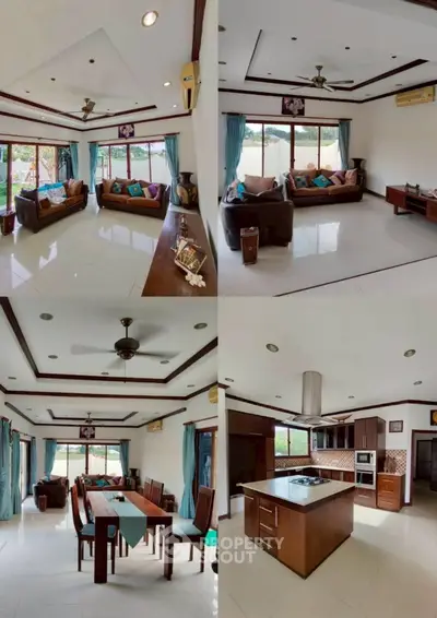 Spacious living and dining area with modern kitchen in luxury home