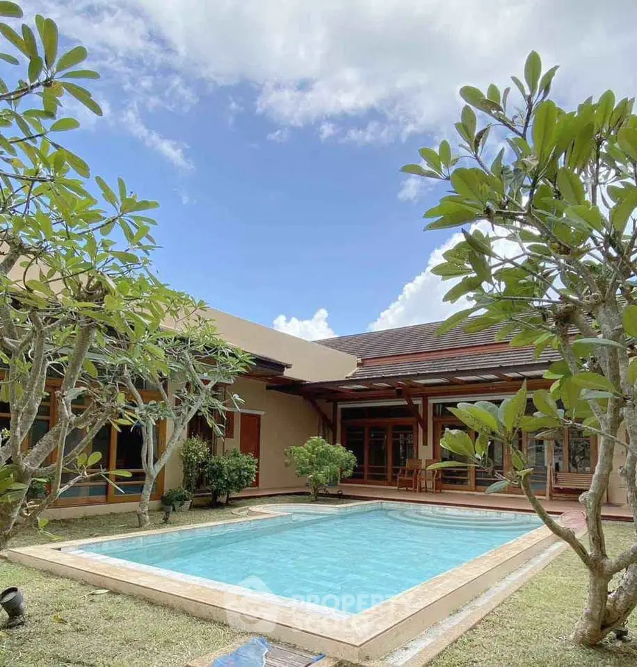 Stunning villa with private pool and lush garden, perfect for luxurious living.