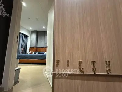 Modern bedroom with stylish decor and cozy ambiance in a luxury apartment.