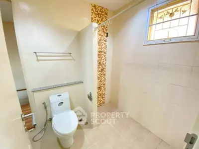 Spacious bathroom with modern fixtures and natural light