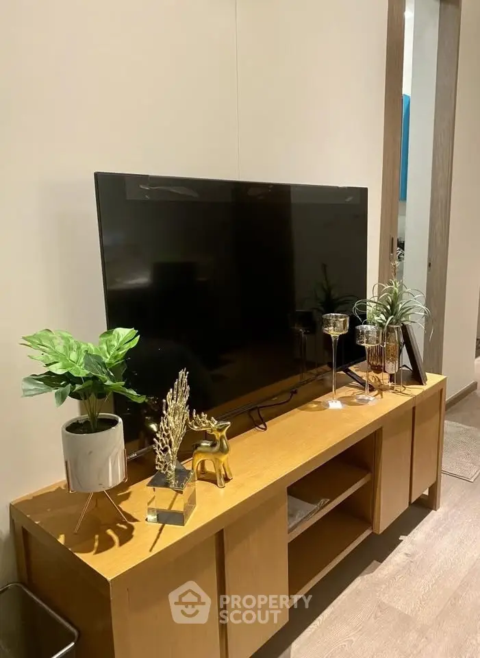 Modern living room with stylish TV stand and decor accents