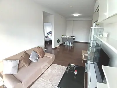 Spacious modern living room with sleek furniture and open layout, perfect for contemporary living.