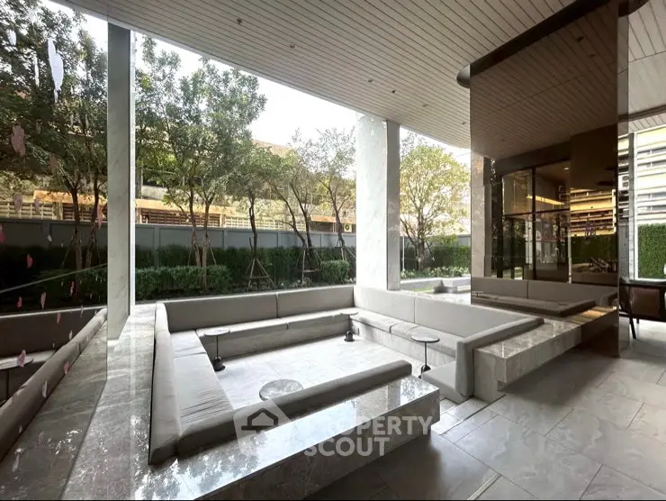 Luxurious outdoor seating area with modern design and lush greenery