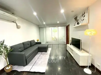 Modern living room with sleek furniture and ambient lighting