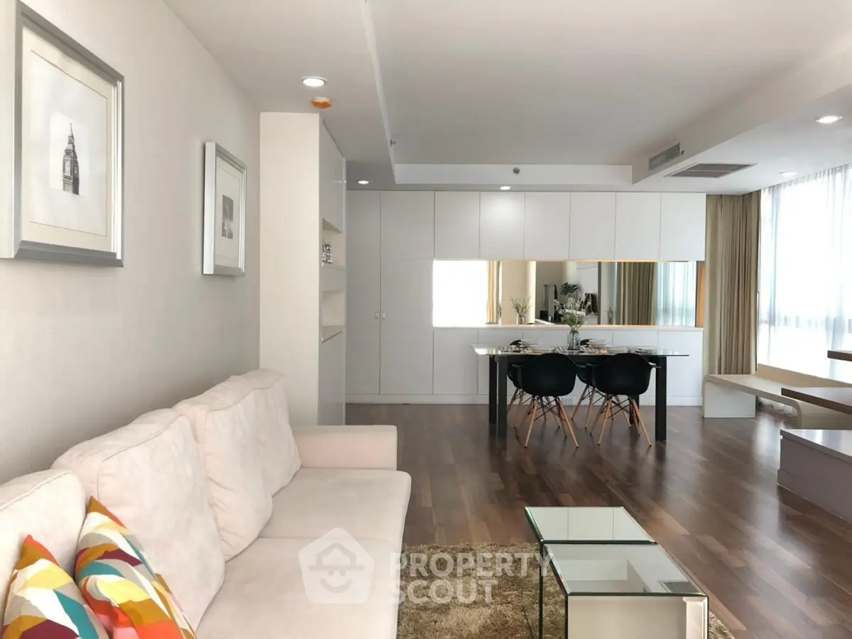 Modern living room with sleek dining area and stylish decor