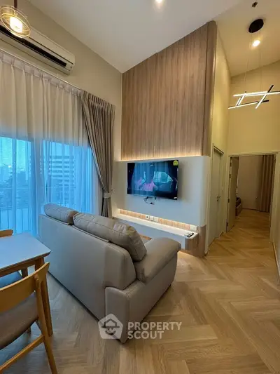 Modern living room with high ceiling and stylish decor