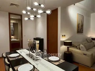 Elegant dining area with modern lighting and cozy living space