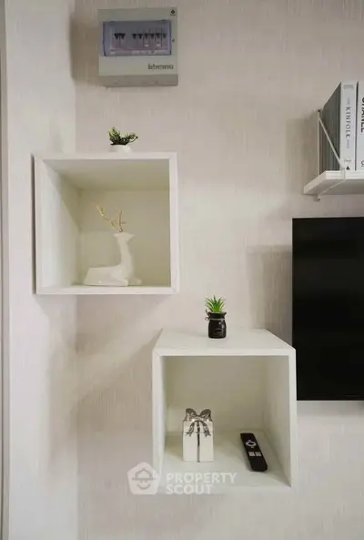 Modern interior with stylish wall-mounted shelves and decor accents