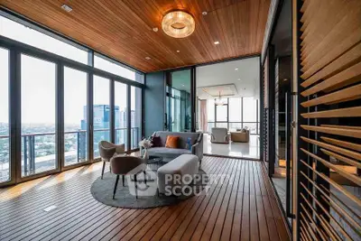 Luxurious corner unit with panoramic city views and elegant wooden flooring.