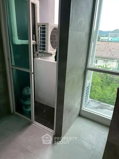 Modern apartment balcony with air conditioning unit and scenic view