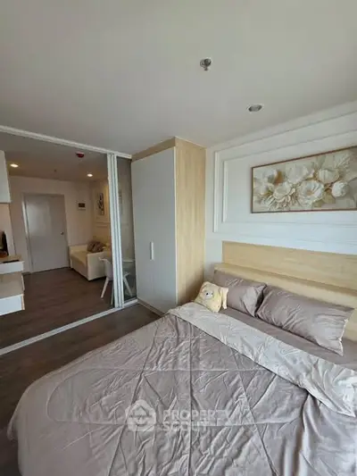 Modern bedroom with stylish decor and cozy ambiance in a contemporary apartment.