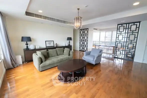 Spacious living room with elegant decor and hardwood floors