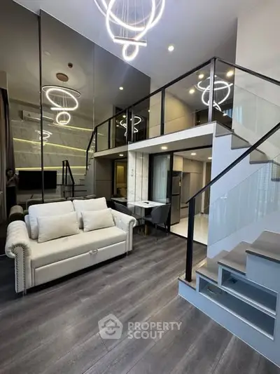Modern loft apartment with stylish living room and mezzanine, featuring sleek design and contemporary lighting.