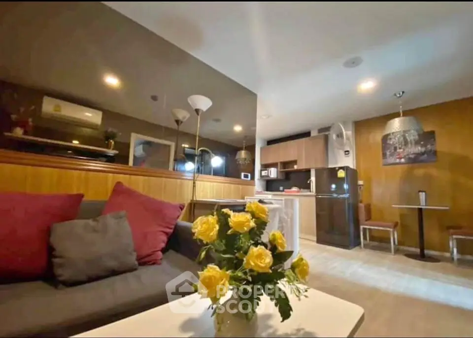 Modern living room with open kitchen and stylish decor