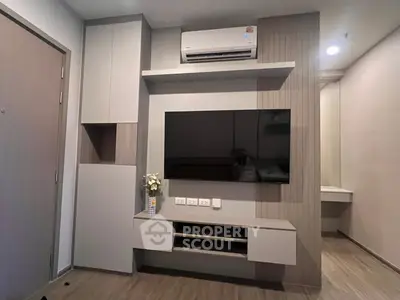 Modern living room with sleek TV unit and air conditioning, perfect for contemporary urban living.