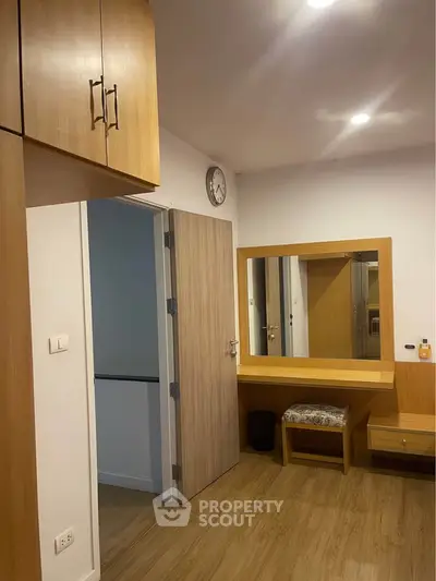 Modern bedroom with wooden furniture and built-in wardrobe