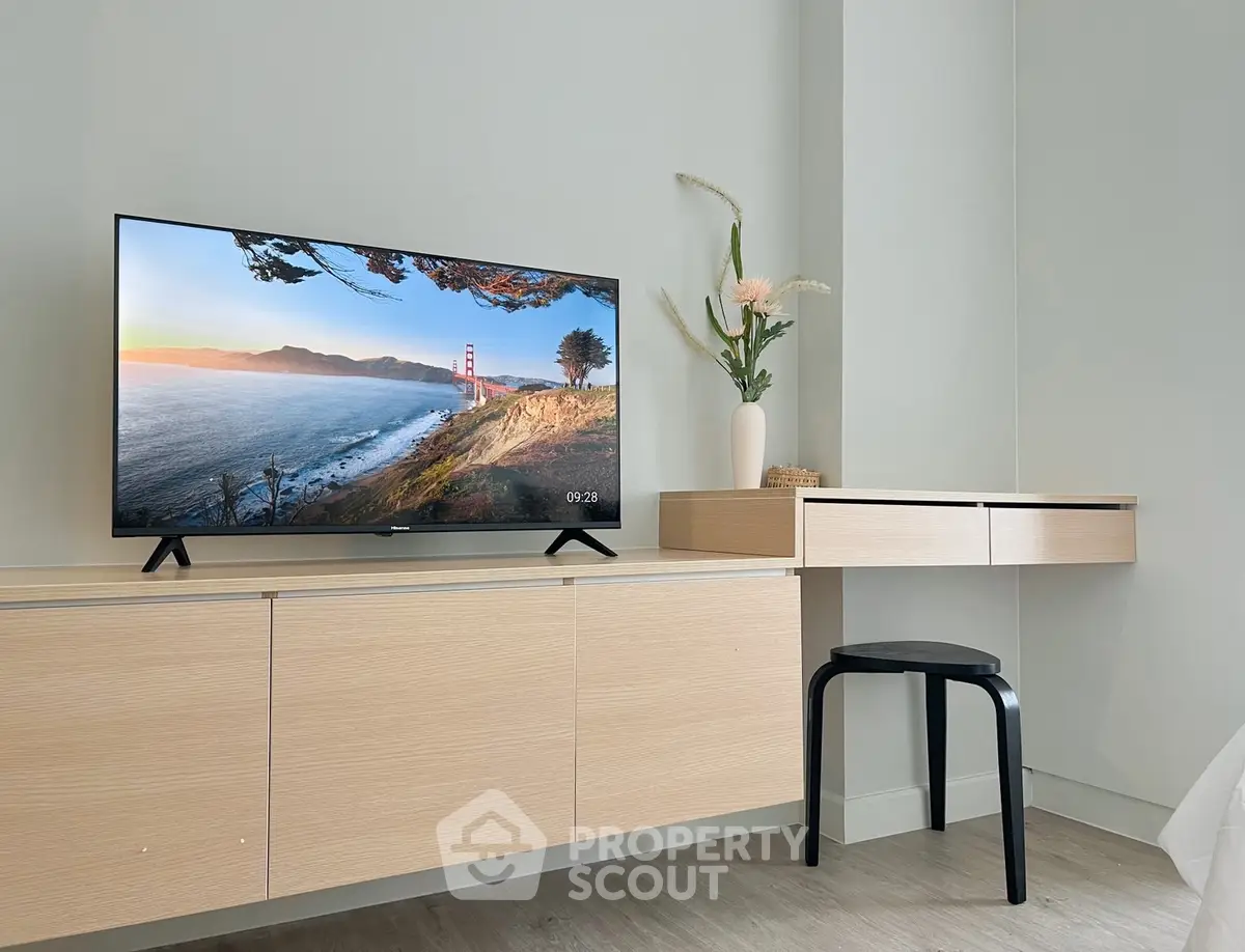 Modern minimalist living room with sleek TV and stylish decor