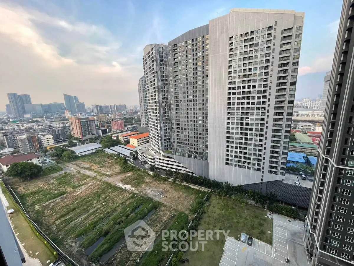 Stunning cityscape view from high-rise building showcasing urban skyline and modern architecture.