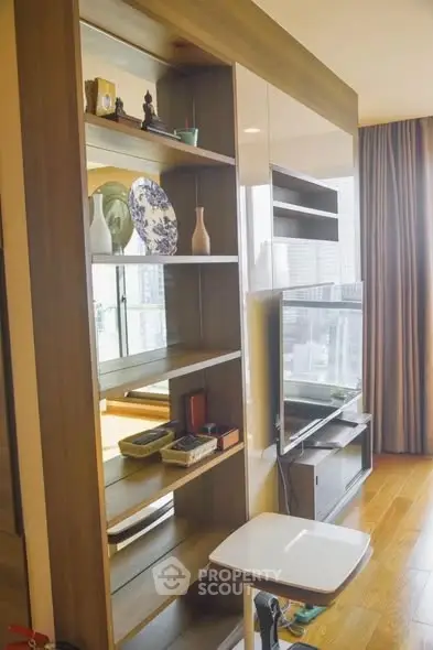 Modern living room with stylish shelving and city view, perfect for urban living.
