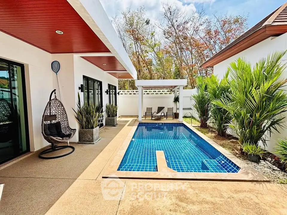 Luxurious villa with private pool and modern outdoor seating area, perfect for relaxation and entertainment.