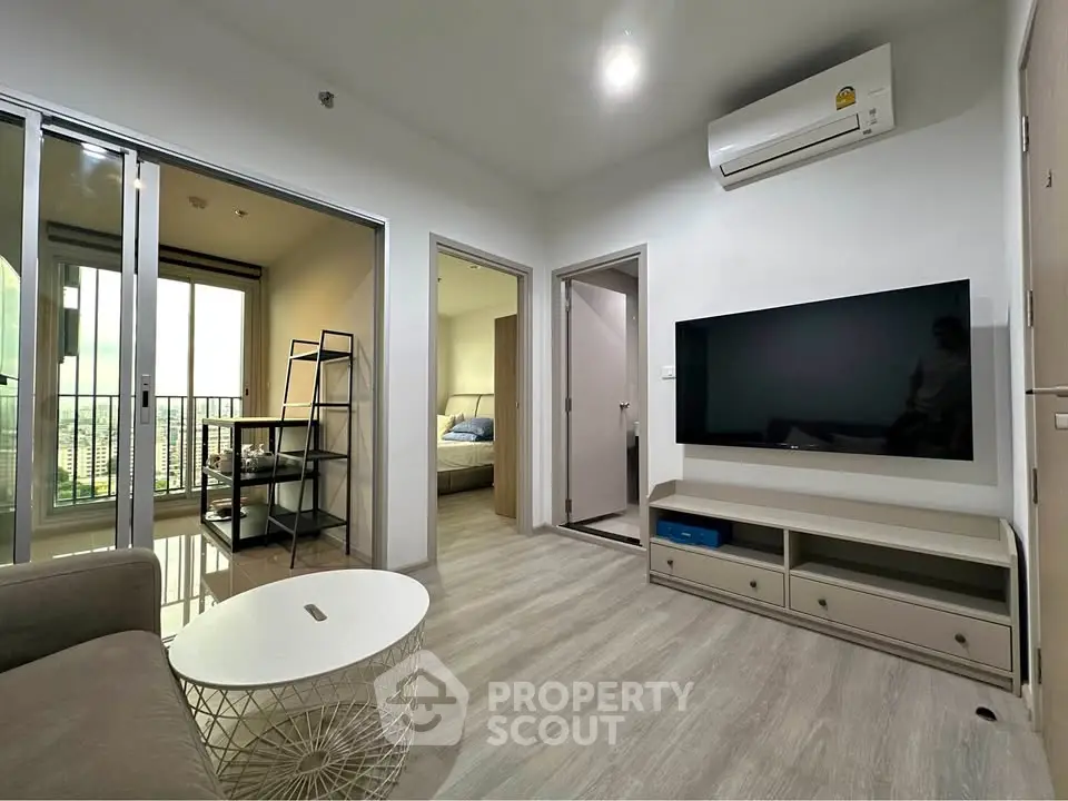 Modern living room with balcony access and sleek interior design