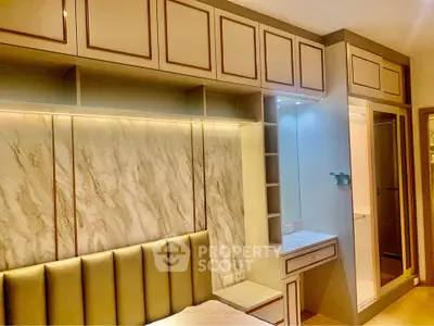 Luxurious bedroom with elegant built-in storage and ambient lighting