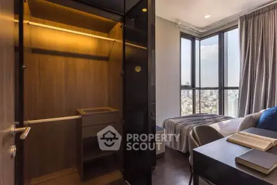 Modern bedroom with city view and walk-in closet, perfect for urban living.