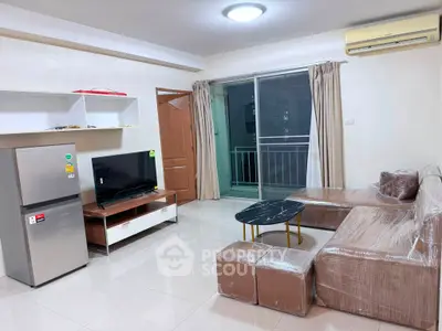 Modern living room with sleek furniture and balcony access in a stylish apartment.