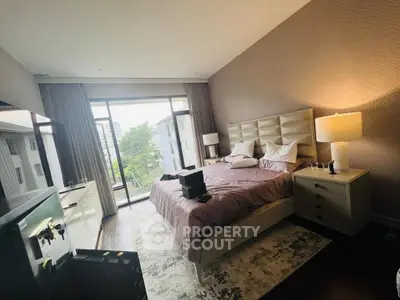 Luxurious bedroom with large window and elegant decor in modern apartment