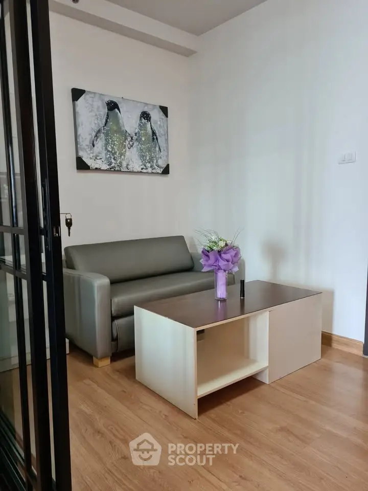 Cozy living room with modern sofa and stylish coffee table, perfect for relaxation.