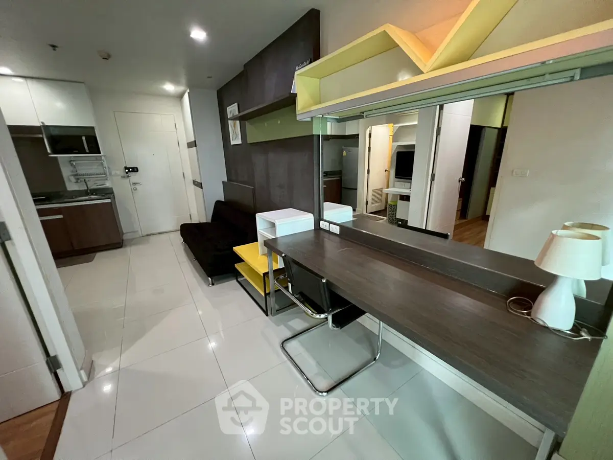 Modern apartment interior with sleek kitchen and stylish living area