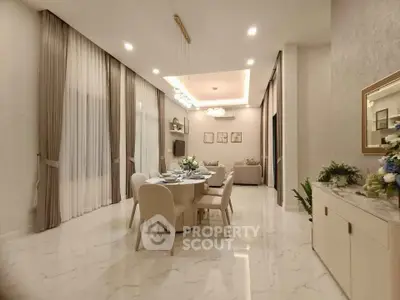 Elegant dining and living area with modern decor and soft lighting, perfect for entertaining guests.