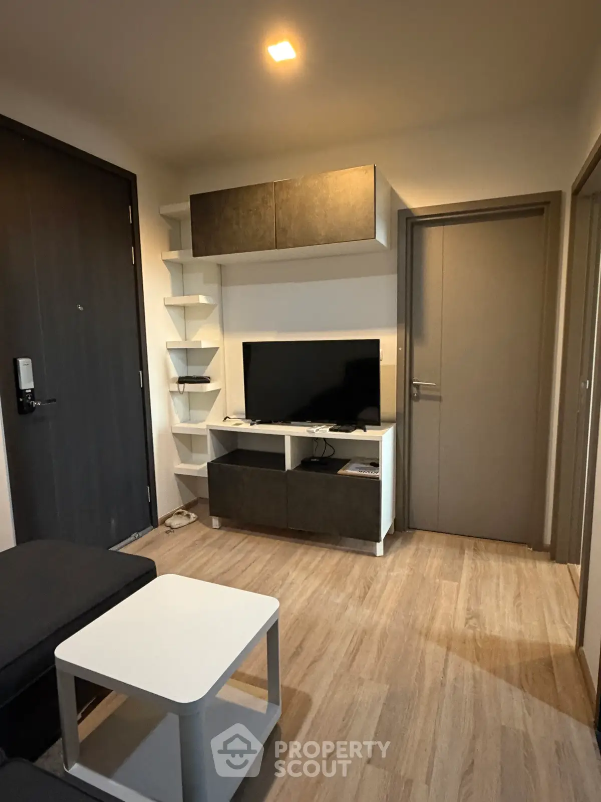 Modern living room with sleek TV unit and stylish shelving