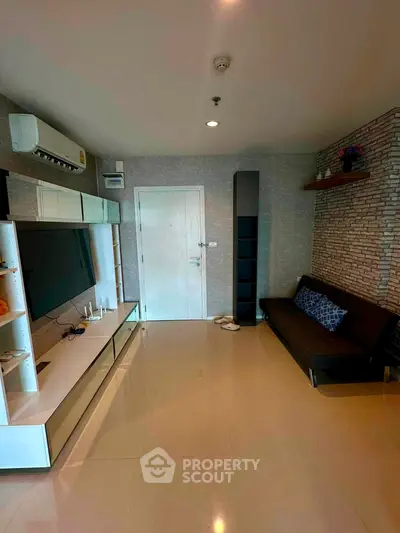 Modern living room with sleek furniture and stylish decor in a contemporary apartment.