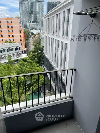 Charming balcony with city view, perfect for relaxation and enjoying urban living.