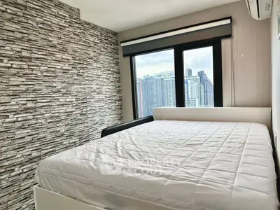 Modern bedroom with city view and stylish stone accent wall