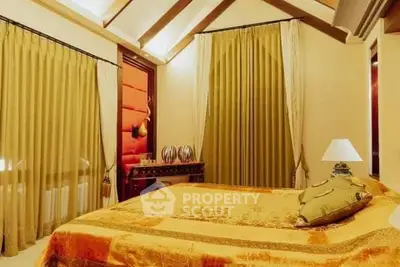 Luxurious bedroom with elegant drapes and warm lighting