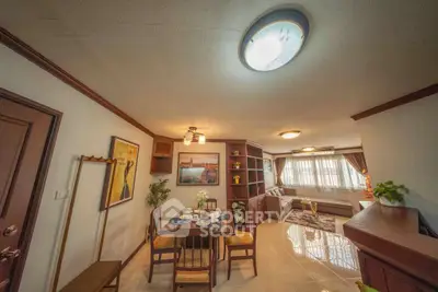 Spacious living and dining area with elegant decor and natural light