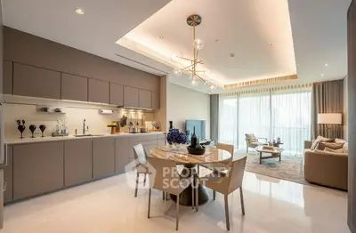 Luxurious open-plan living room and kitchen with modern decor and ample natural light.