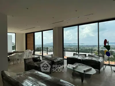 Luxurious living room with panoramic ocean view and modern furnishings