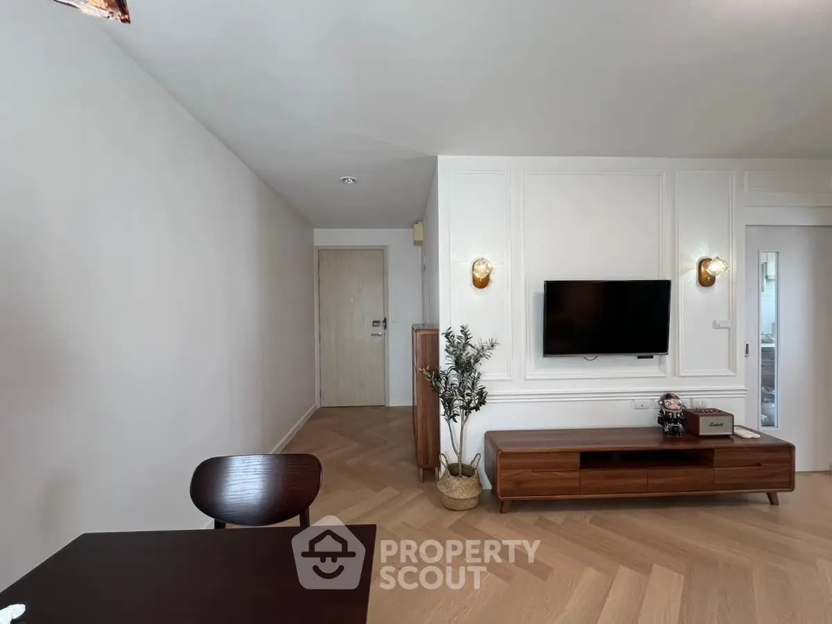 Modern living room with stylish decor and wall-mounted TV