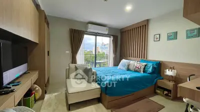 Cozy and inviting studio apartment with modern furnishings, ample natural light, and a comfortable living area, perfect for urban living.