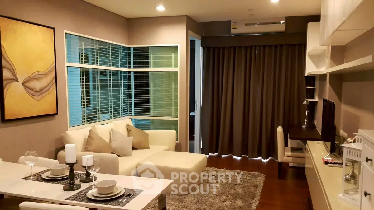 Modern living room with cozy seating and elegant decor