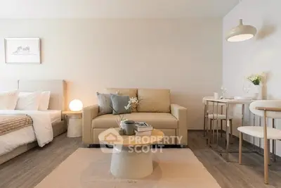 Modern studio apartment with cozy living area and stylish decor