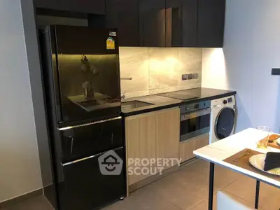 Modern kitchen with sleek appliances and stylish cabinetry