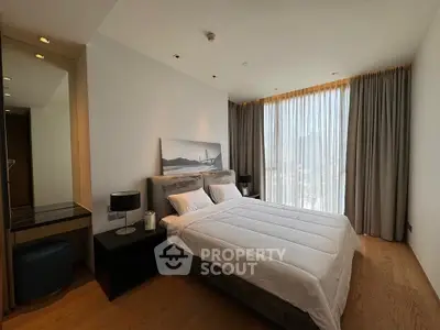 Luxurious modern bedroom with large window and elegant decor