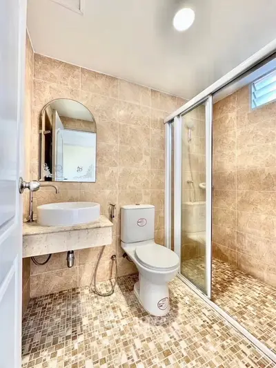 Modern bathroom with elegant tile design and glass shower enclosure