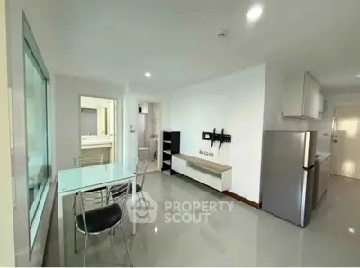 Modern apartment interior with sleek kitchen and dining area